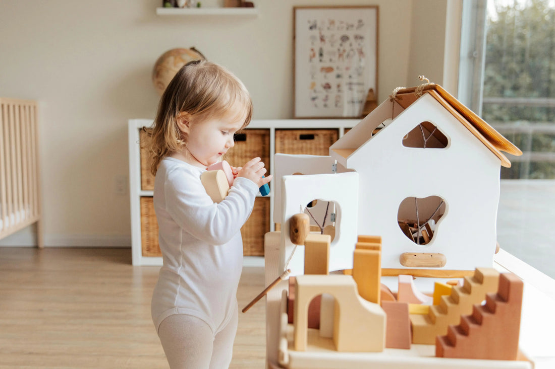 Child building problem-solving skills through structured play with natural wooden toys